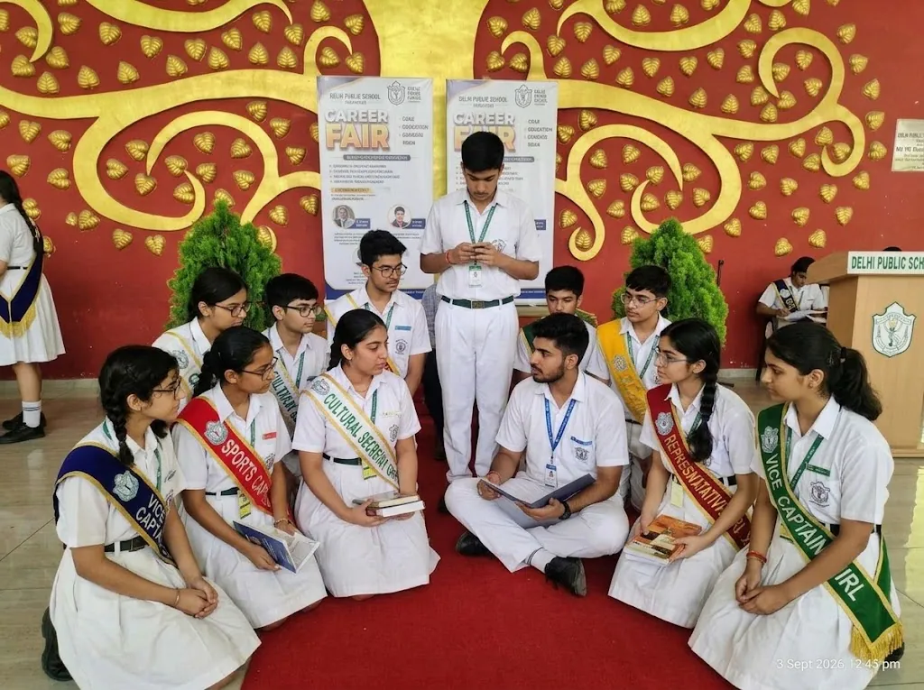 Student council cohort seated together in school uniforms with badges